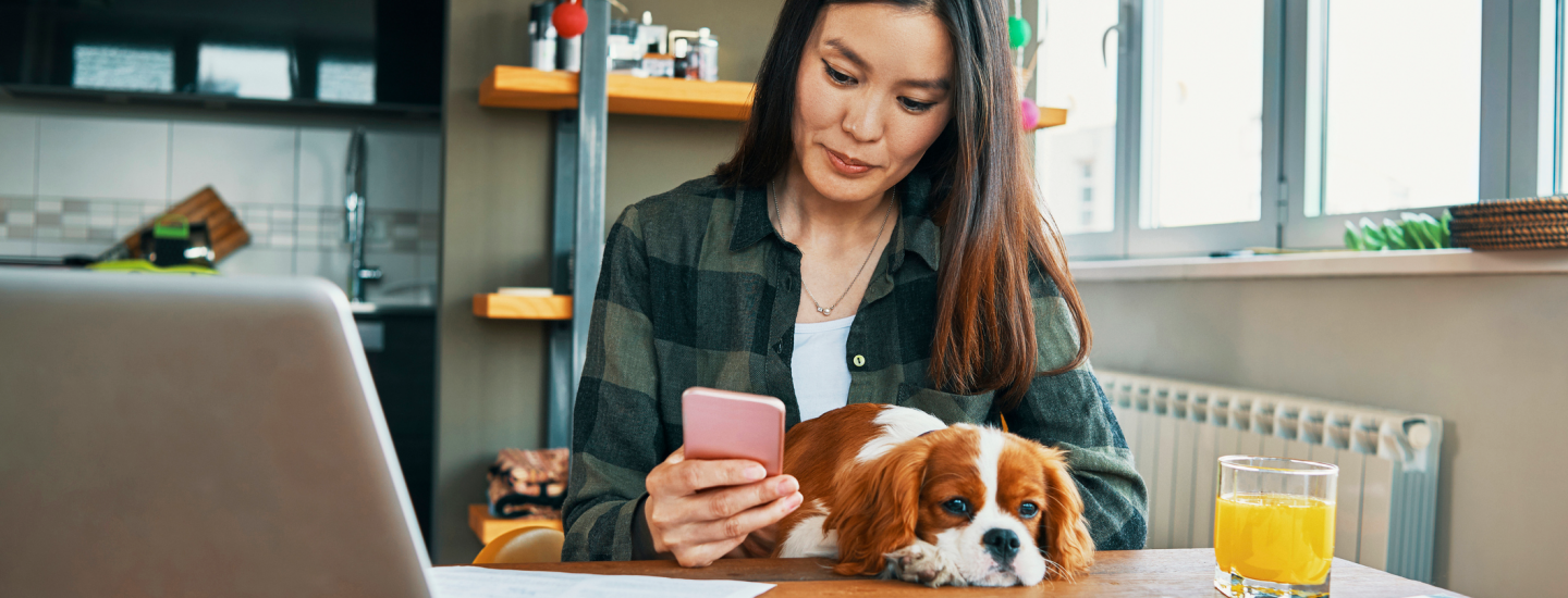 girl texting with dog