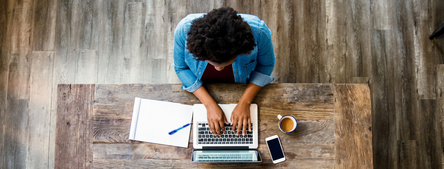woman typing on laptop
